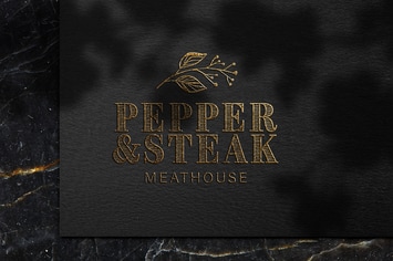 Luxury embossed gold logo mockup on black paper 