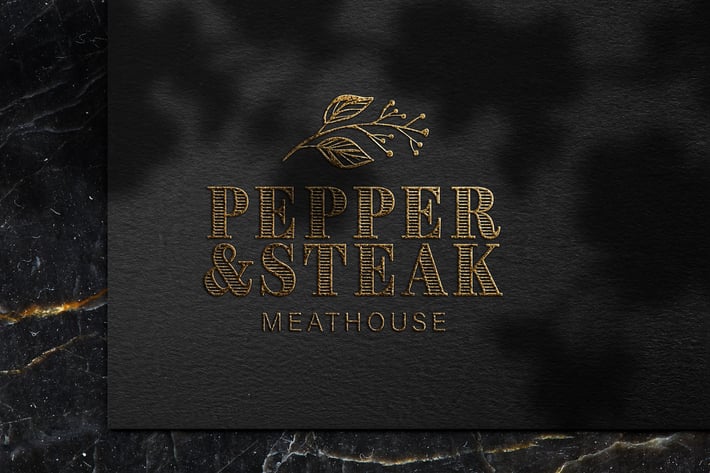 Luxury embossed gold logo mockup on black paper 