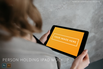 Person Holding iPad Photo Mockup Grey Background