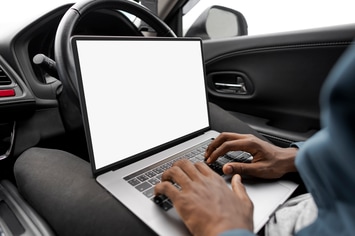 Laptop Screen Mockup in a New Self Driving Car