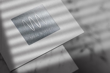 Debossed Silver Logo Mockup on Linen Paper