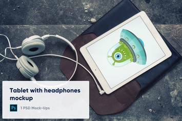 Tablet with Headphones on Stone Background Mockup