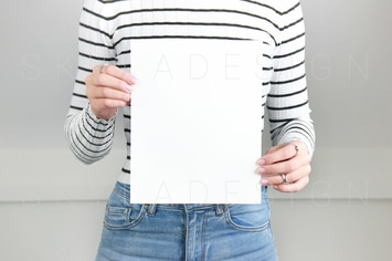 Poster held by woman mockup