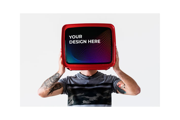 Person with tattoo holding television Mockup