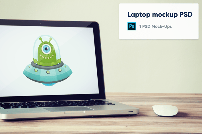 Laptop on wooden desk with mouse - Mockup PSD