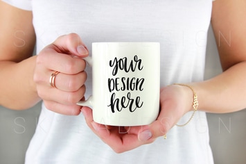 White coffee mug held by woman mockup 