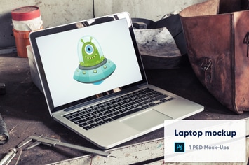 Laptop in Old Factory PSD Mockup