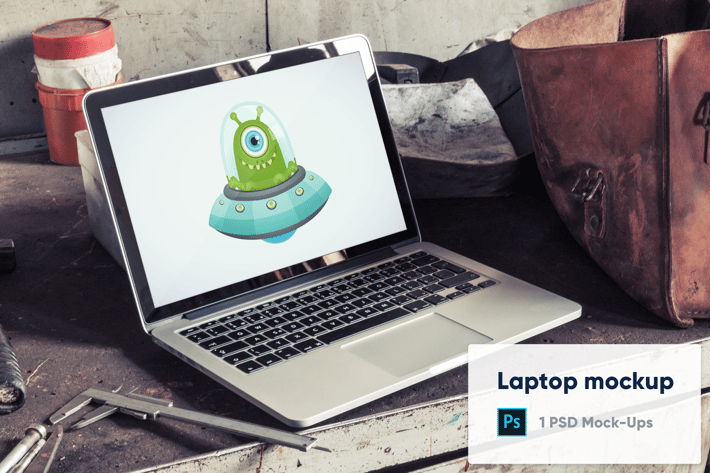 Laptop in Old Factory PSD Mockup