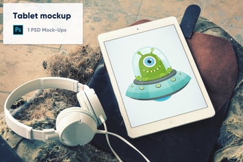 Tablet with Headphones on Leather Case PSD Mockup