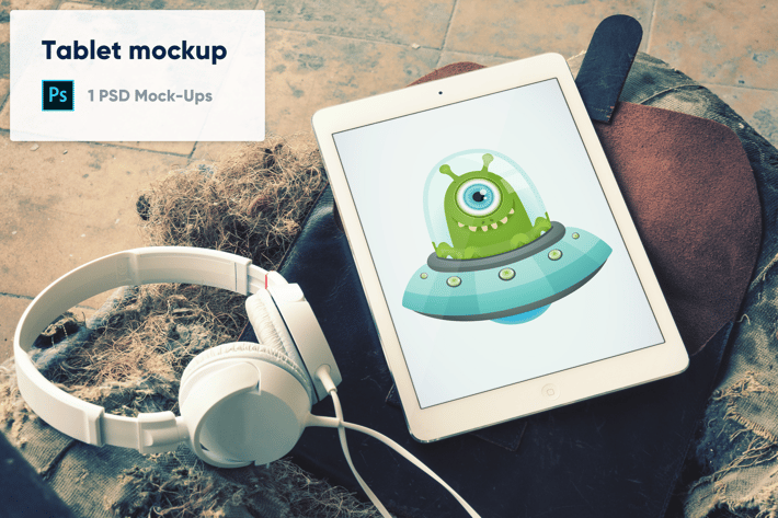 Tablet with Headphones on Leather Case PSD Mockup