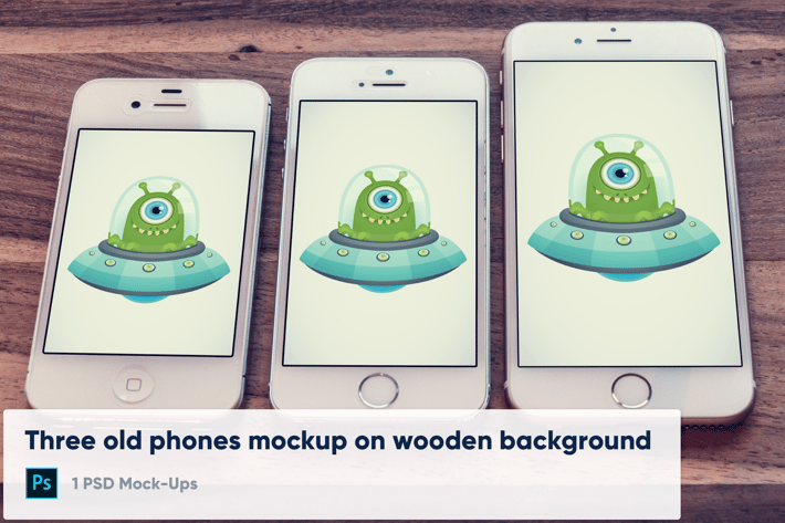 3 old phones mockup on wooden background