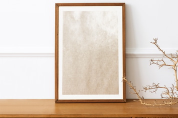 Picture frame mockup on a wooden sideboard table