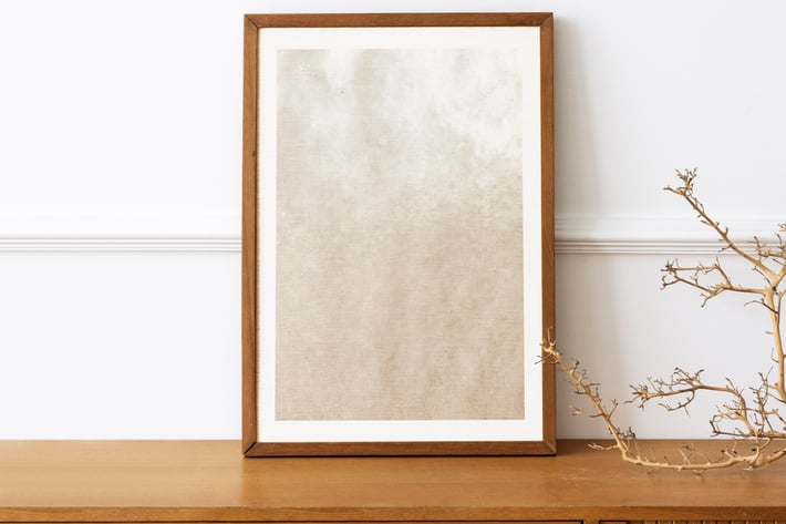 Picture frame mockup on a wooden sideboard table
