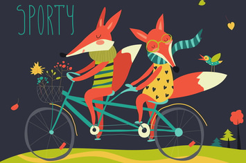 Cute couple foxes ride tandem bicycle
