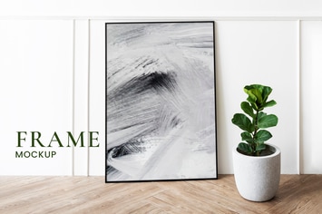 Picture frame mockup by a fiddle-leaf fig plant