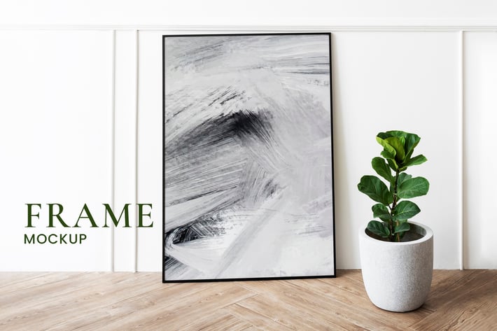 Picture frame mockup by a fiddle-leaf fig plant