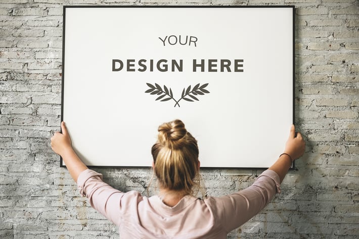Blonde Girl Holding a Mockup Frame