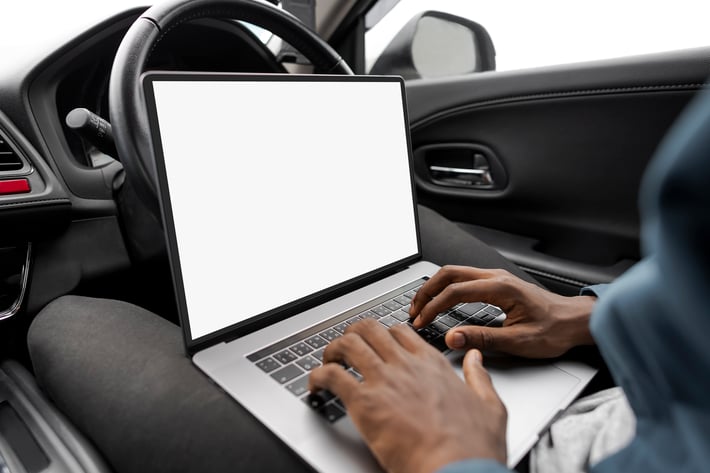 Laptop Screen Mockup in a New Self Driving Car