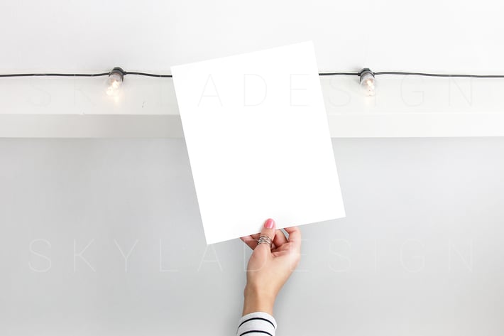 Poster held by woman mockup
