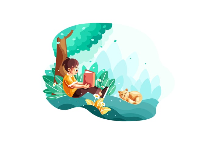 Young little kid reading a book sitting under tree