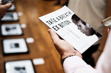 Man Holding Art Brochure Mockup 
