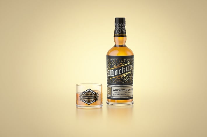 Whiskey Bottle and Glass Mockup