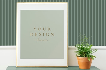 Picture frame mockup on a green wooden cabinet