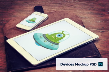 Laptop and Phone on Wooden Table Mockup PSD