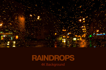 Night Raipdrops on Window Background