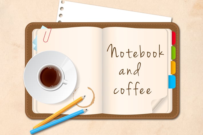 Notebook and Coffee Cup