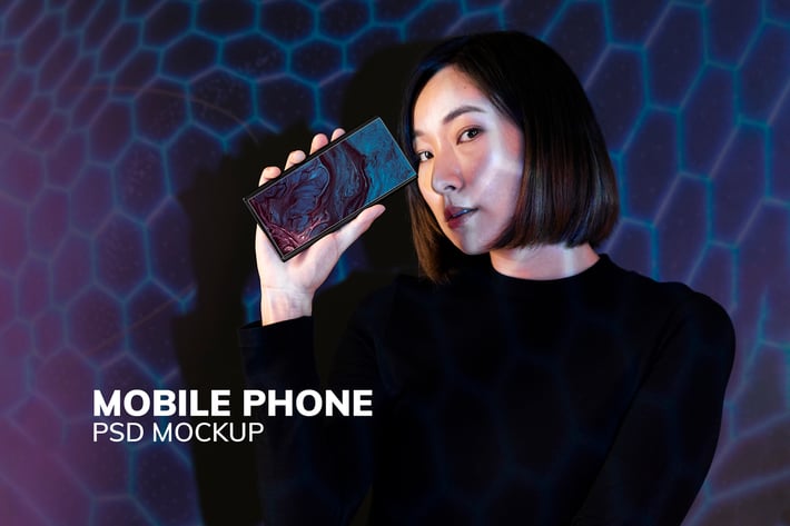 Woman showing smartphone screen mockup psd
