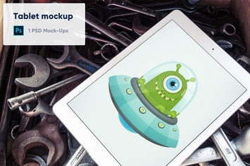 Tablet on Old Wrenches PSD Mockup