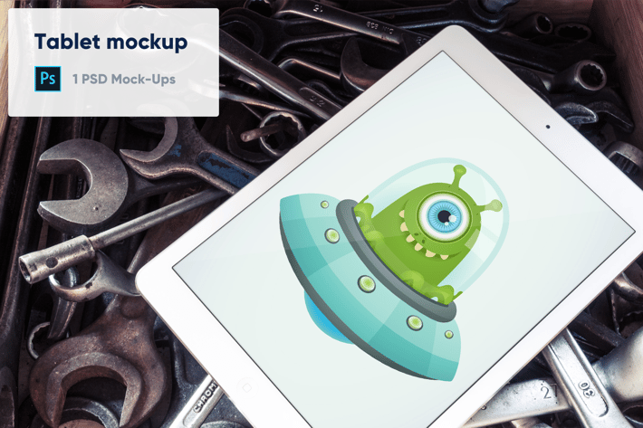 Tablet on Old Wrenches PSD Mockup