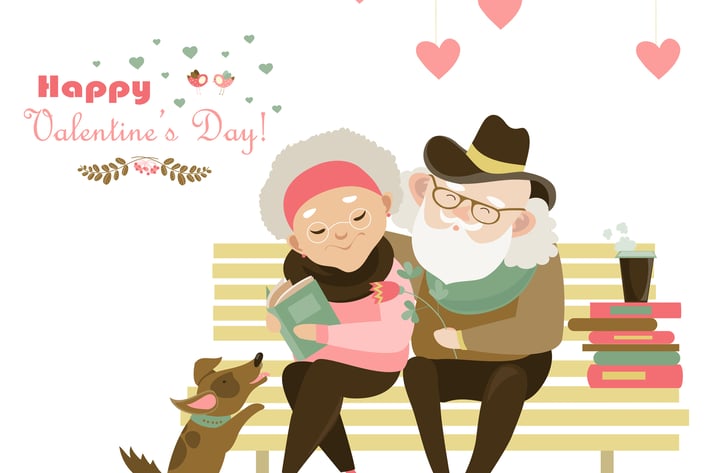 Old couple in love sitting on bench