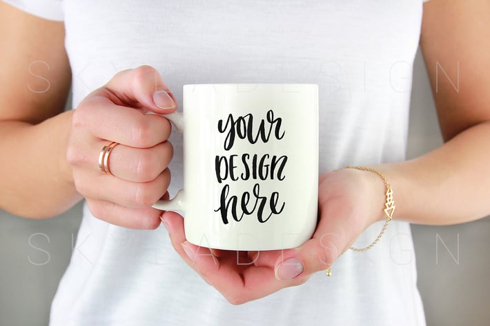 White coffee mug held by woman mockup 