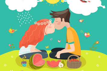 Young couple kissing at a meadow 