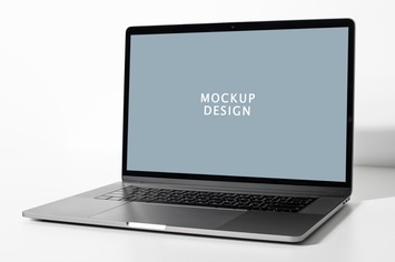 Laptop screen mockup on a white table