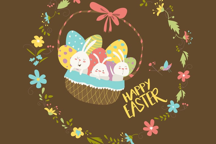 Easter bunnies sitting in a basket with eggs