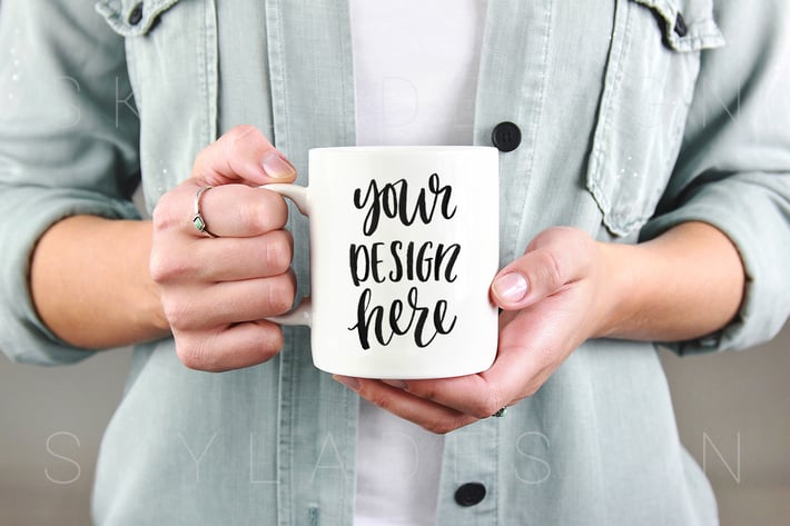 White coffee mug held by woman mockup 