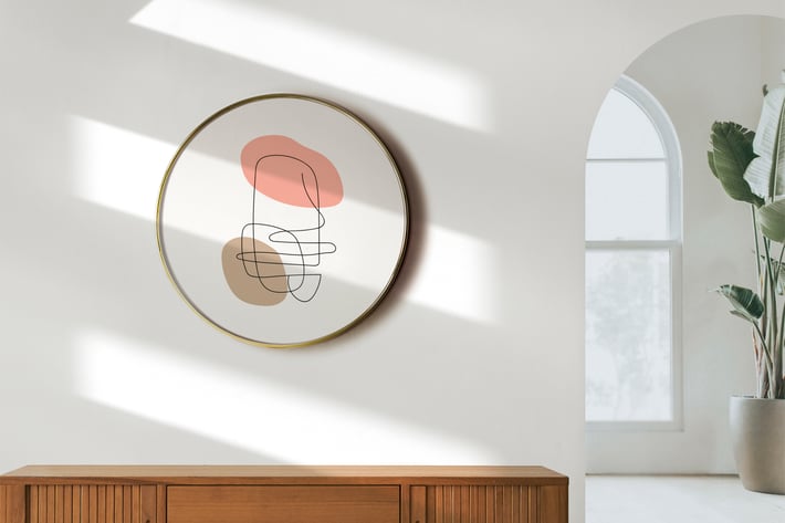 Circle frame mockup hanging on the white wall