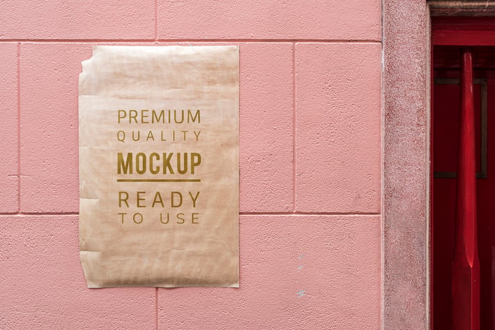 Poster mockup on a pink wall