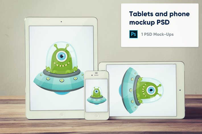 Tablets and phone on wooden background mockup PSD