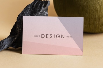 Blank business card on beige background mockup