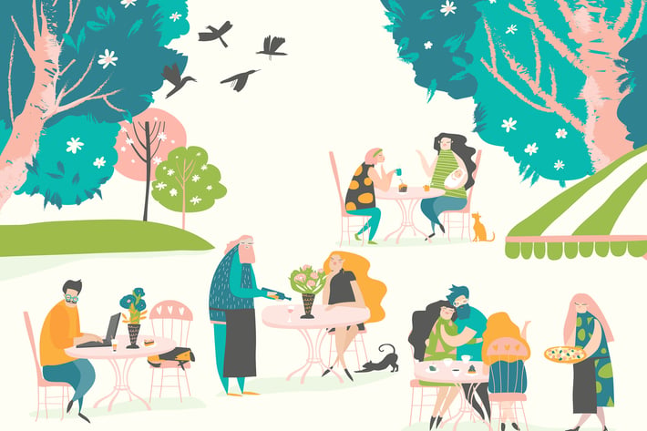 Many people sitting and drinking coffee at outdoor