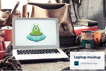 Laptop in Old Factory PSD Mockup