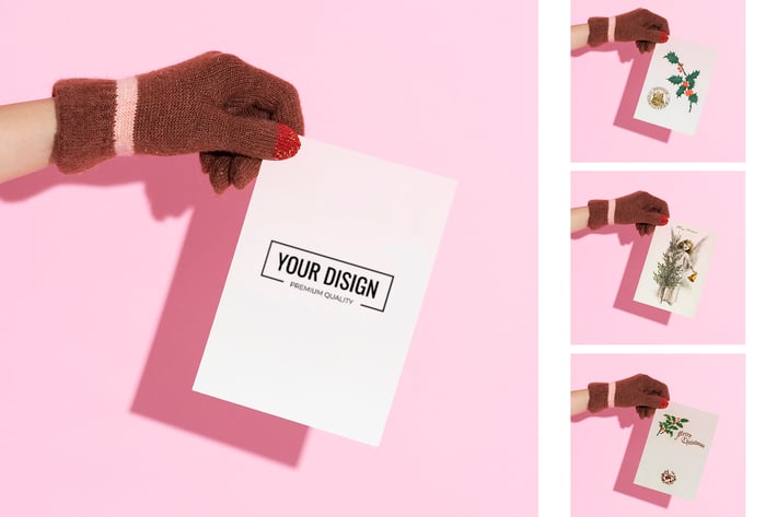 Hand wearing glove holding a paper mockup